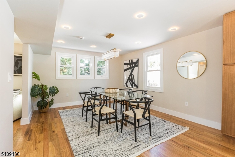 27 Oakridge Road West Orange, NJ 07052 - Photo 14 of 29 a view of a dining room with furniture and a potted plant
