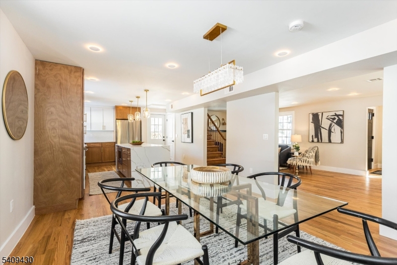27 Oakridge Road West Orange, NJ 07052 - Photo 15 of 29 a view of a dining room with furniture and a potted plant