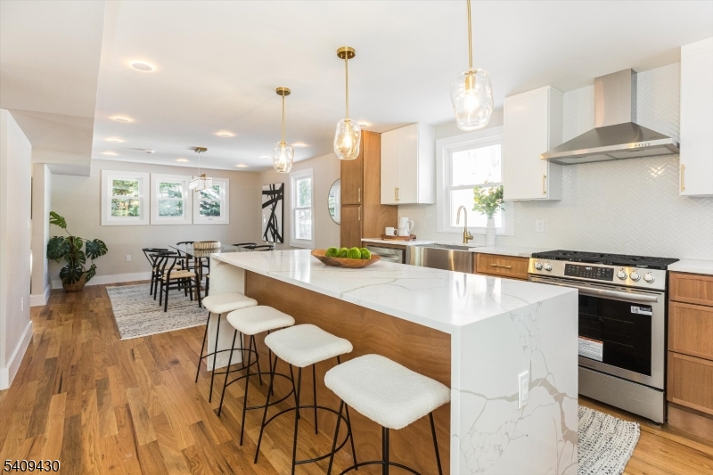 27 Oakridge Road West Orange, NJ 07052 - Photo 16 of 29 a large kitchen with a table and chairs