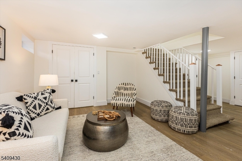 27 Oakridge Road West Orange, NJ 07052 - Photo 26 of 29 a living room with furniture and a chair
