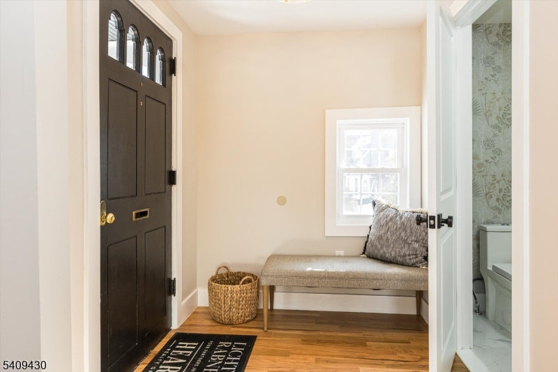 27 Oakridge Road West Orange, NJ 07052 - Photo 5 of 29 a bedroom with a bed and wooden floor