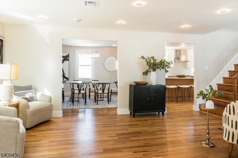 27 Oakridge Road West Orange, NJ 07052 - Photo 8 of 29 a living room with furniture and wooden floor