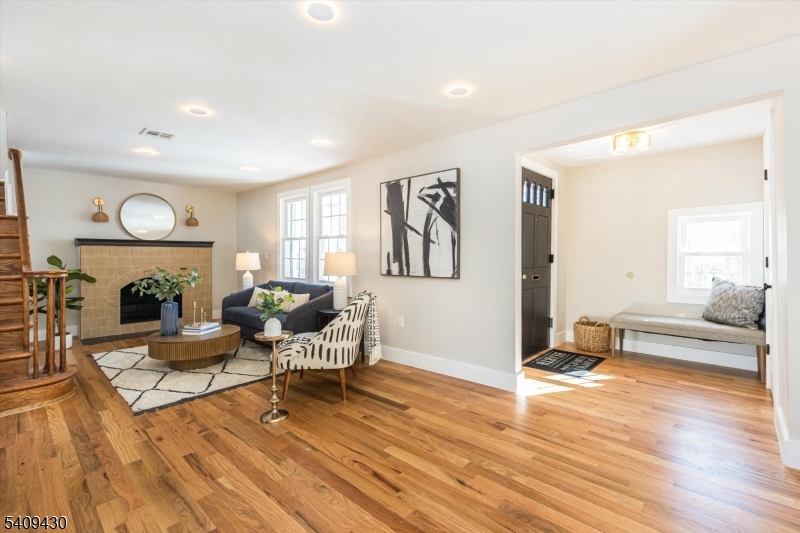 27 Oakridge Road West Orange, NJ 07052 - Photo 9 of 29 a living room with furniture and a fireplace