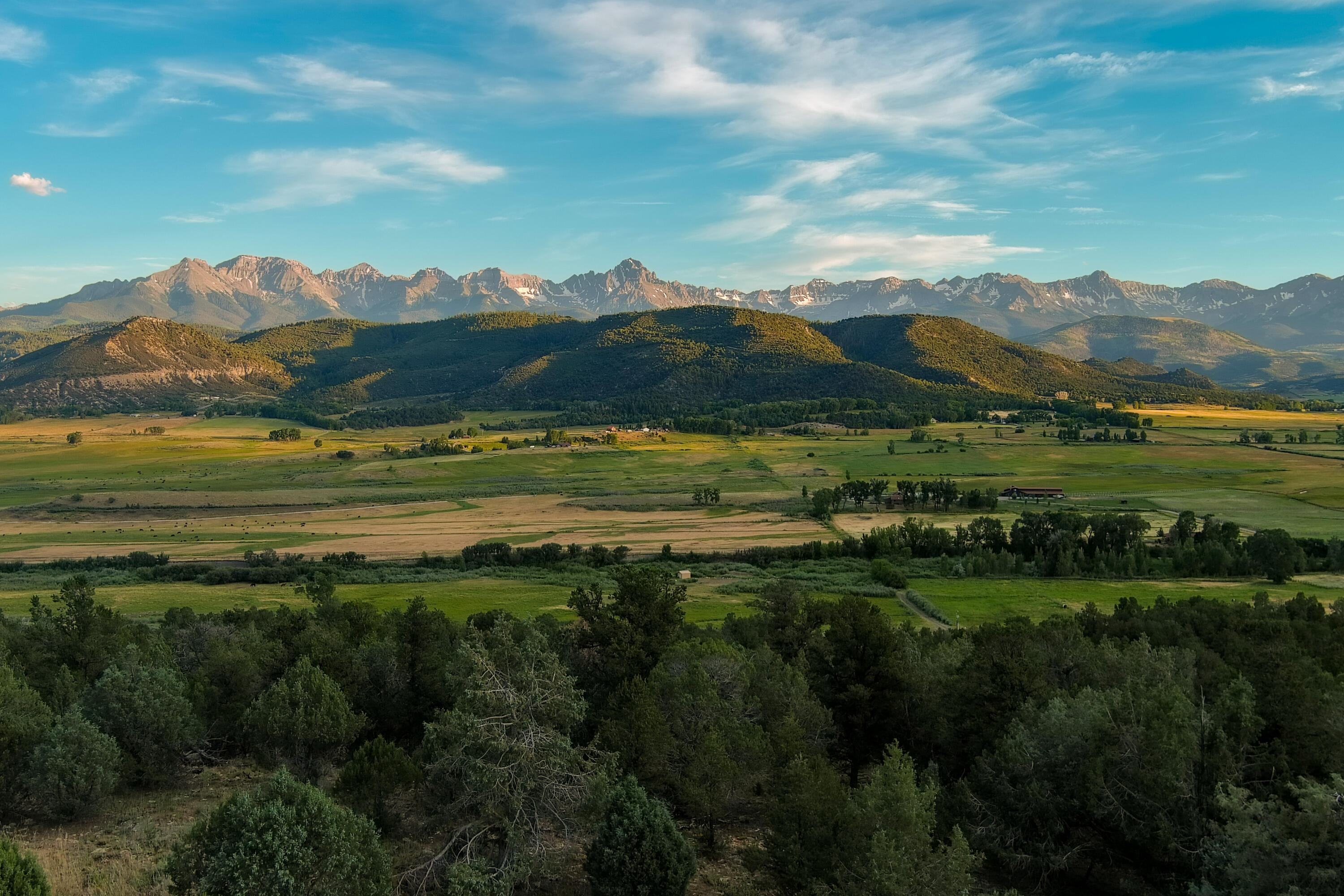 a view of a town with mountains in the background