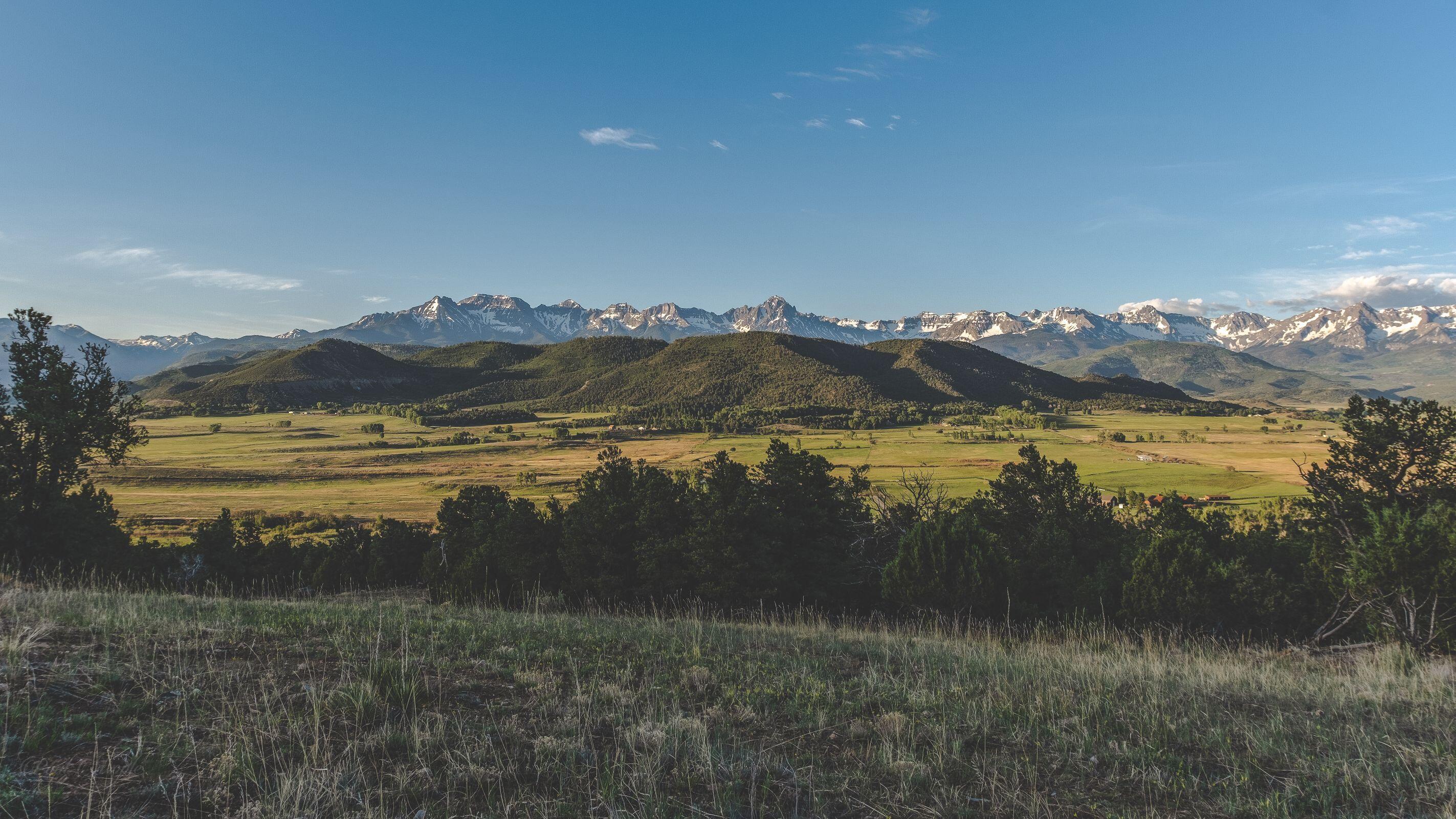 3073 County Road 24 Ridgway, CO 81432 - Photo 12 of 17 a view of a lake with a mountain in the background