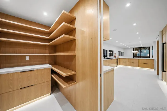 a bathroom with a double vanity sink and mirror