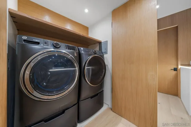a view of a livingroom with wooden floor and a window