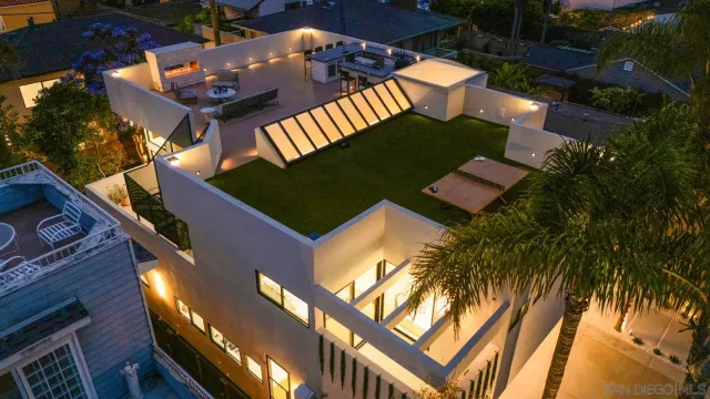 a view of a kitchen with a sink and cabinets