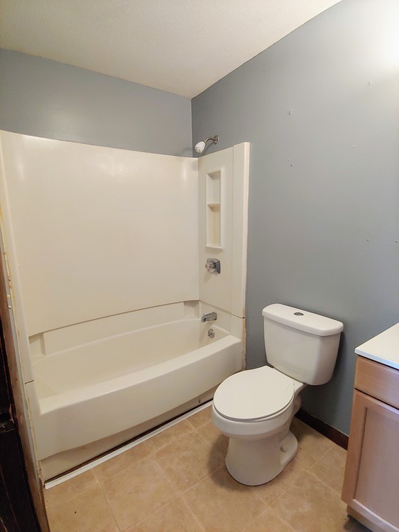 2186-2188 Palmer Road Three Rivers, MA 01080 - Photo 14 of 17 a bathroom with a toilet a sink and a bathtub