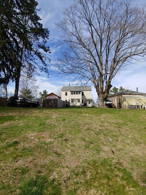 2186-2188 Palmer Road Three Rivers, MA 01080 - Photo 17 of 17 a front view of a house with a big yard
