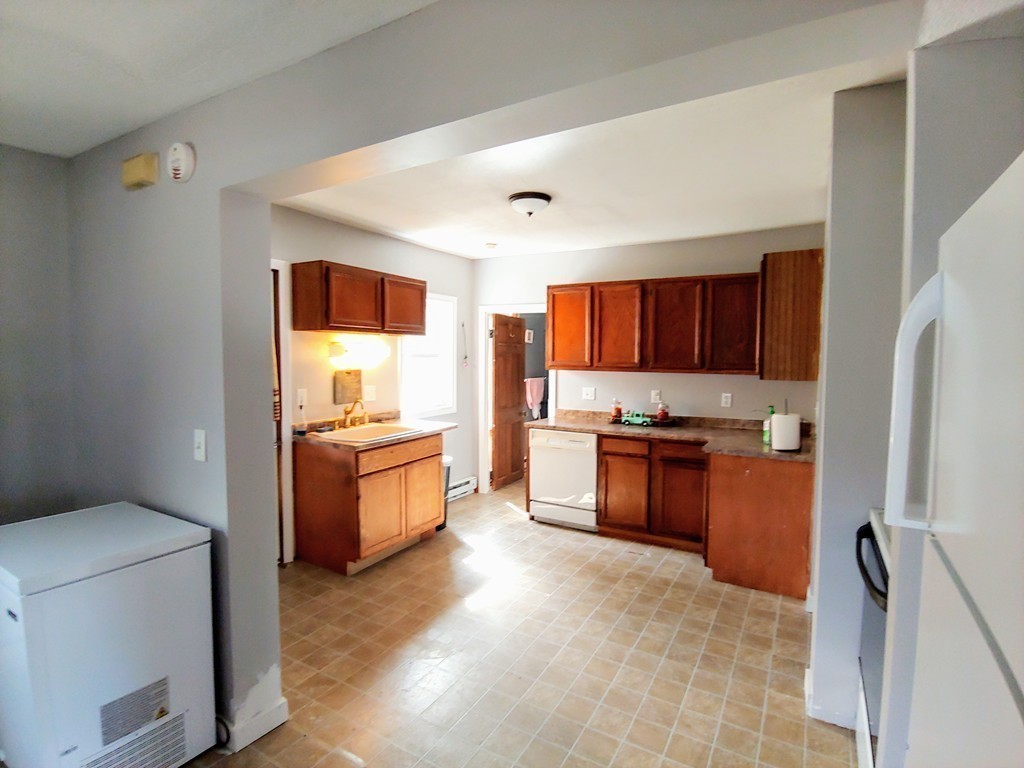 2186-2188 Palmer Road Three Rivers, MA 01080 - Photo 4 of 17 a large kitchen with a stove and a refrigerator