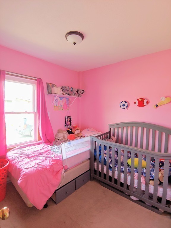 2186-2188 Palmer Road Three Rivers, MA 01080 - Photo 7 of 17 a bedroom with a bed and a window