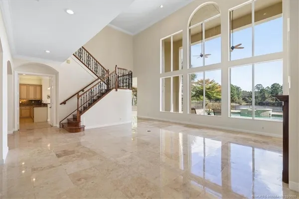 a kitchen with stainless steel appliances granite countertop a sink a stove and cabinets