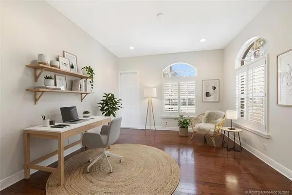 a large bathroom with a large tub sink vanity and granite