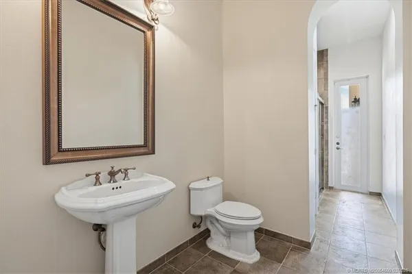 a view of staircase with wooden floor and a dining room