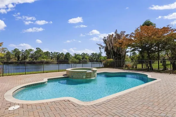 an aerial view of a house with a yard and garden