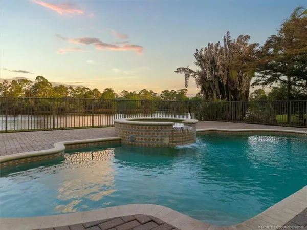 a view of a patio with swimming pool