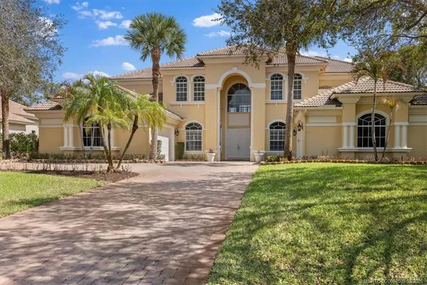 a living room with furniture potted plant and a fireplace