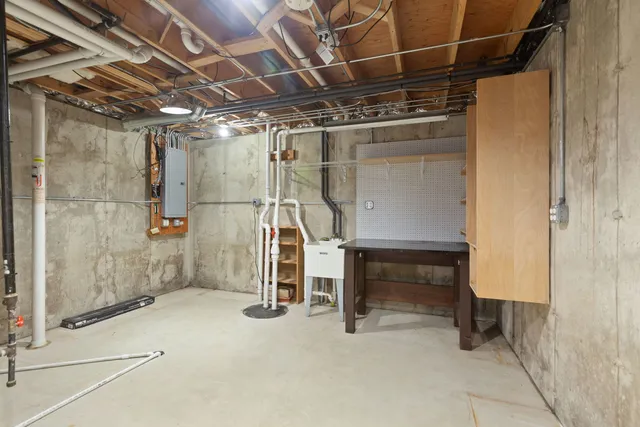 a view of an empty room with a fireplace