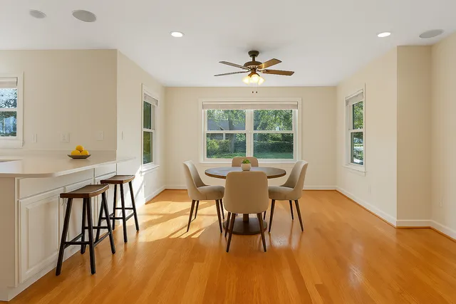 a view of a dining room with furniture window and wooden floor