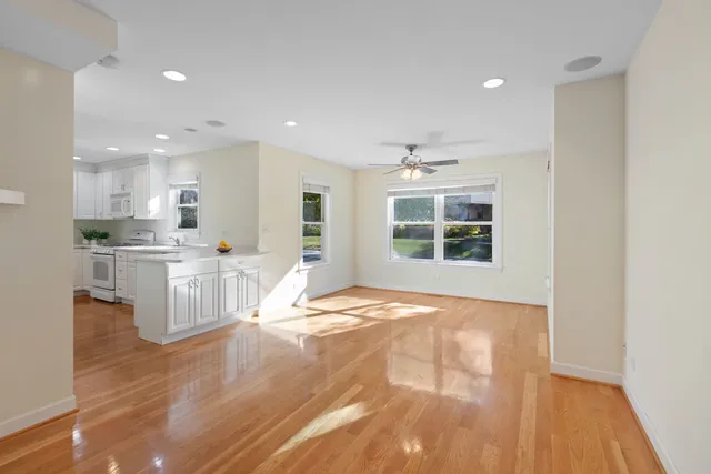 a view of kitchen with granite countertop window and white appliances