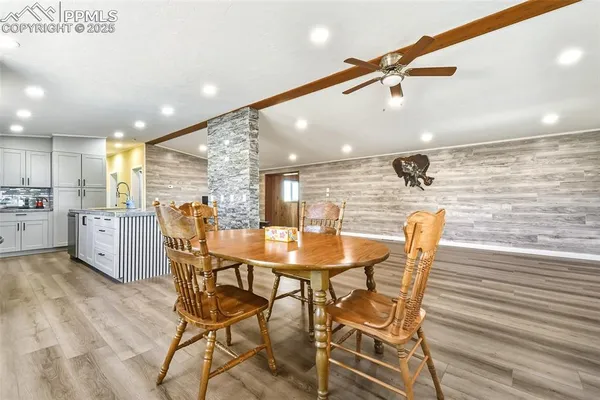 a dining room with furniture and window