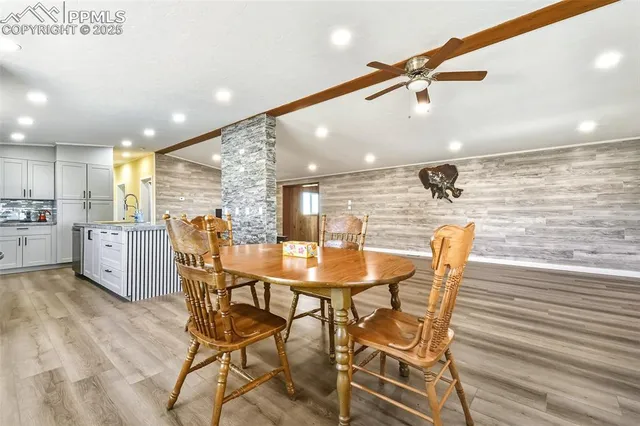 a dining room with furniture and window