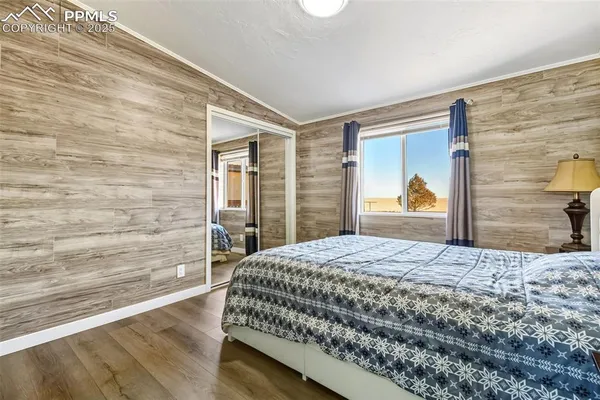 a bedroom with a bed and a dresser