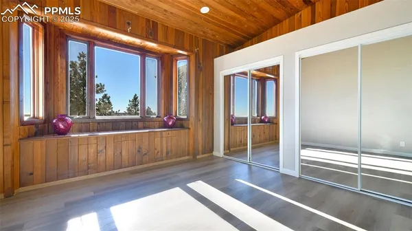 a view of a porch with wooden floor and outer view