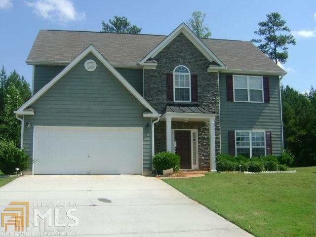120 Stone Ridge Way, Unit 39 Covington, GA 30016 - Photo 1 of 1 a view of a house with a yard