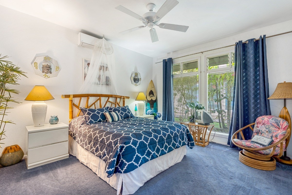 3791 Punahele Road Princeville, HI 96722 - Photo 16 of 30 a bedroom with a bed and a window