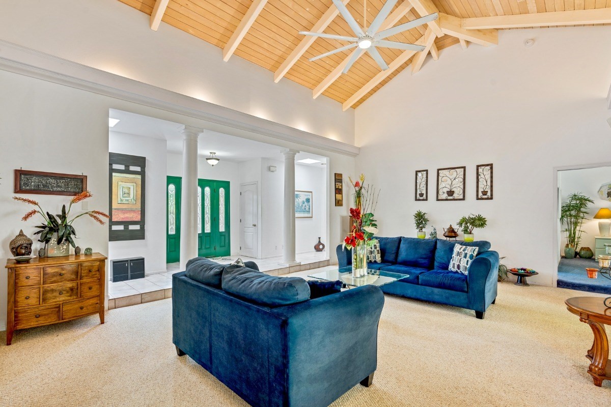 3791 Punahele Road Princeville, HI 96722 - Photo 2 of 30 a living room with furniture and a flat screen tv