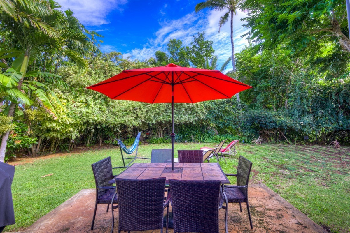 3791 Punahele Road Princeville, HI 96722 - Photo 21 of 30 a view of backyard with seating space and trees
