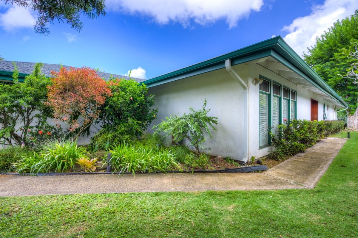 3791 Punahele Road Princeville, HI 96722 - Photo 30 of 30 a backyard of a house with plants and outdoor seating