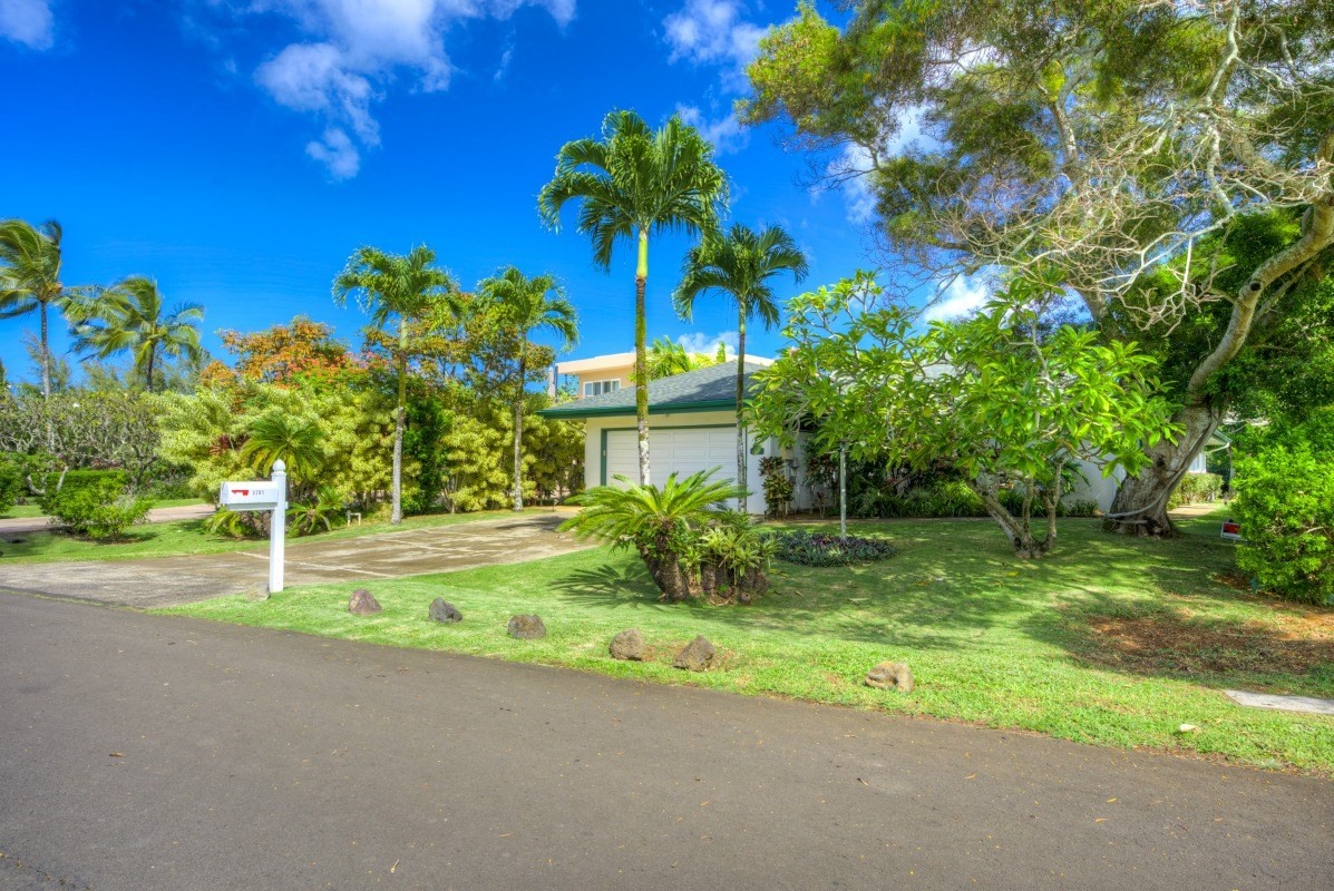 3791 Punahele Road Princeville, HI 96722 - Photo 3 of 30 a view of a yard in front of a house with a street