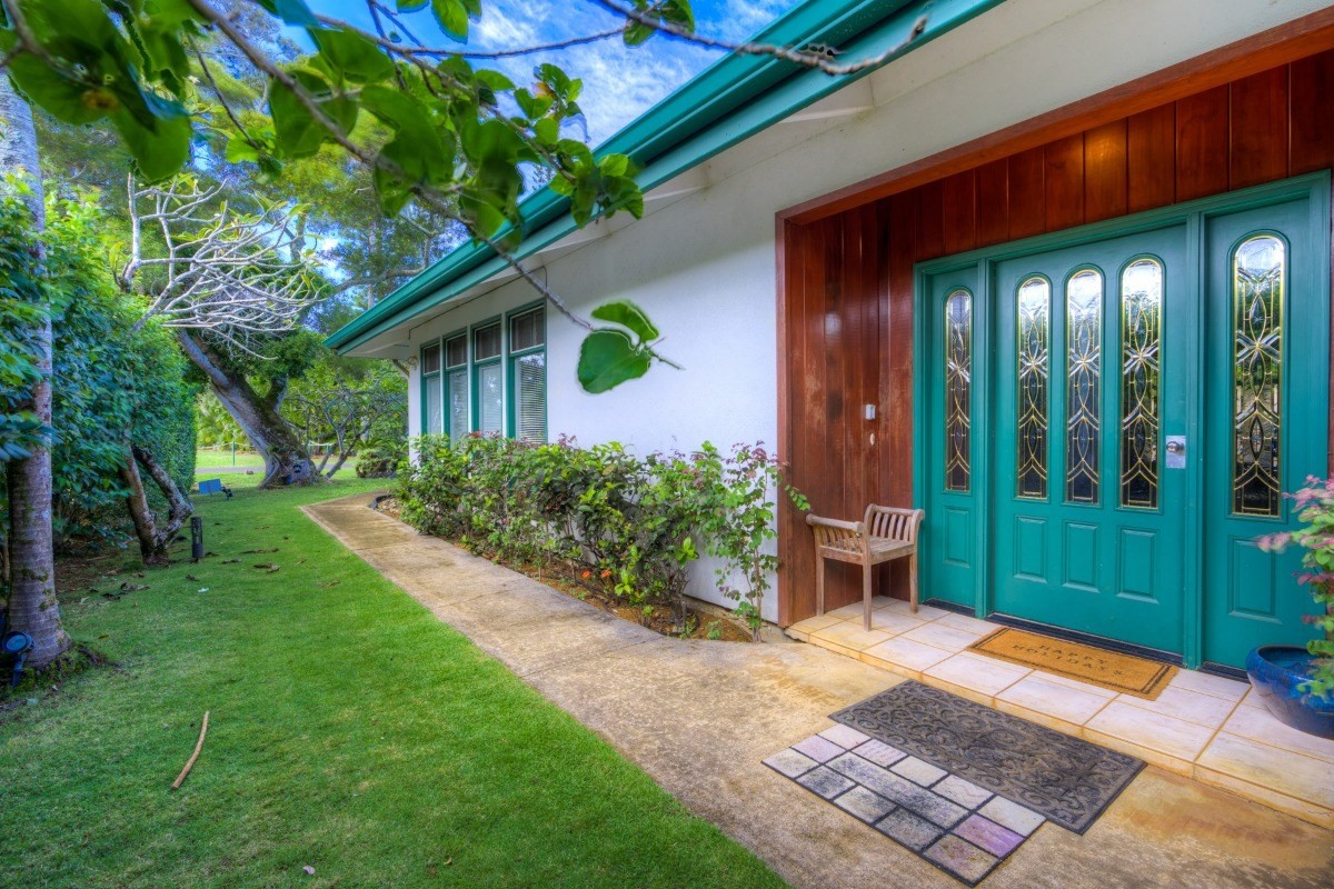 3791 Punahele Road Princeville, HI 96722 - Photo 7 of 30 a backyard of a house with plants and outdoor seating