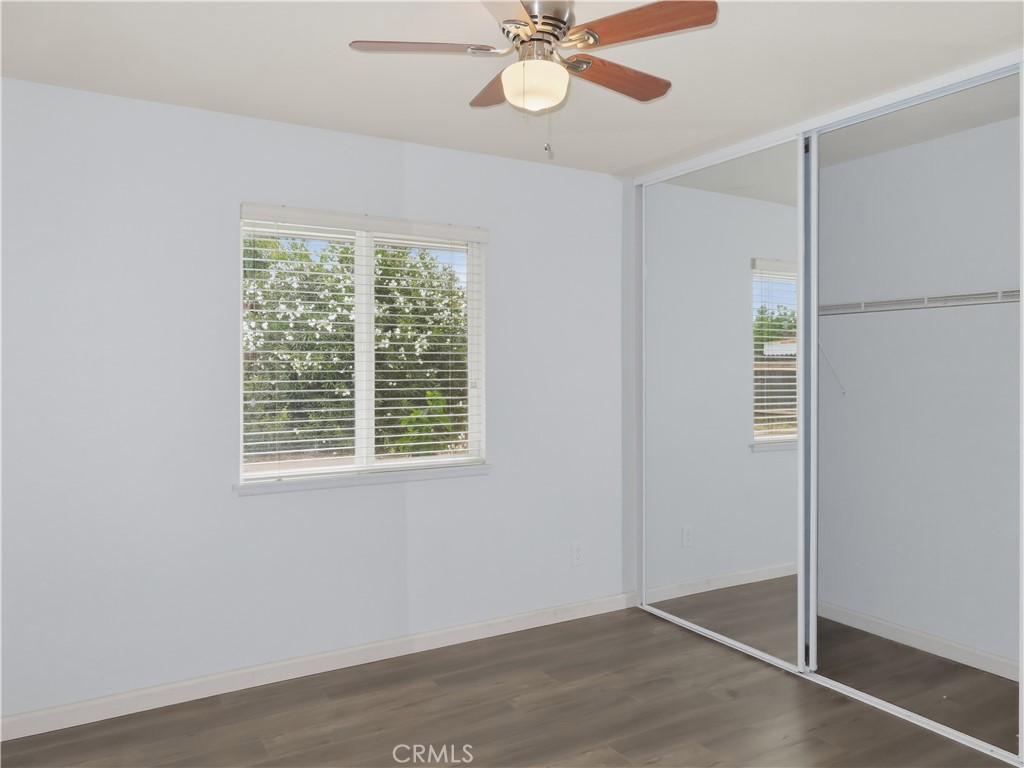 4409 Challen Avenue Riverside, CA 92503 - Photo 16 of 31 a view of an empty room with wooden floor and a window