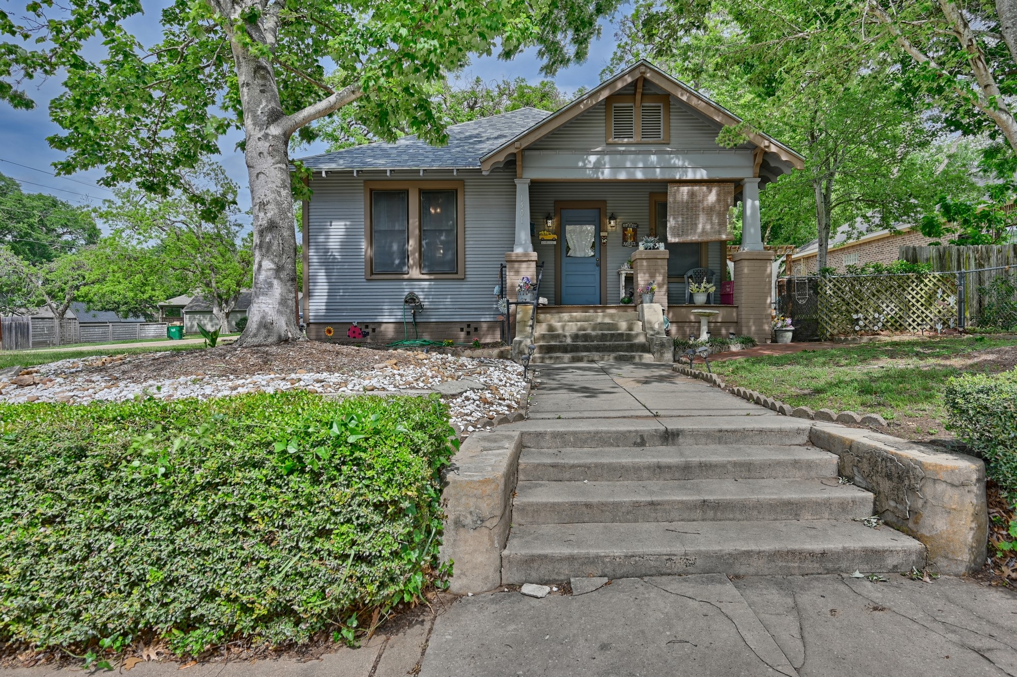 1501 South Austin Street Brenham, TX 77833 - Photo 34 of 36 a front view of a house with garden and porch