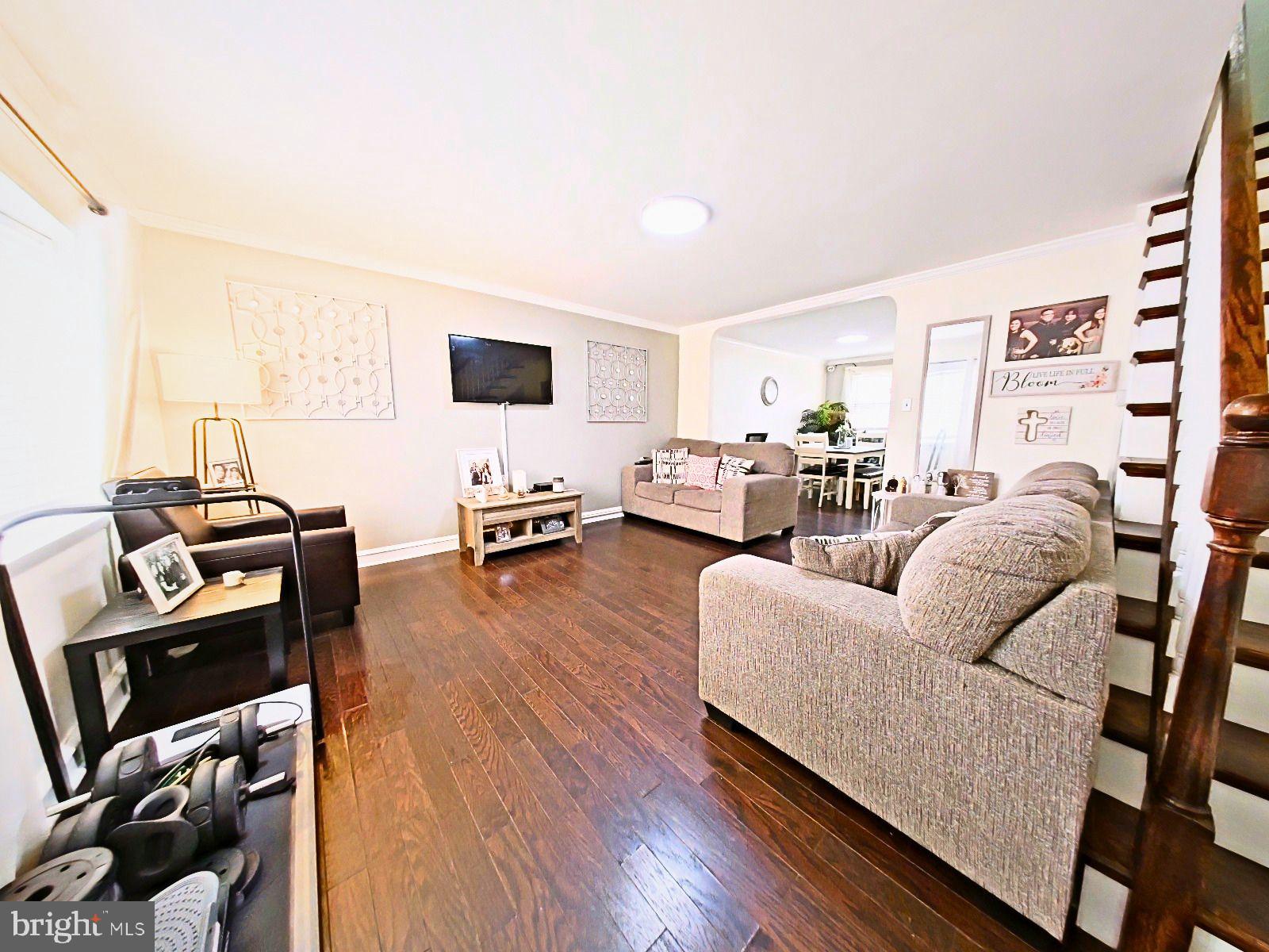 5844 Saul Street Philadelphia, PA 19149 - Photo 13 of 36 a living room with furniture and a flat screen tv