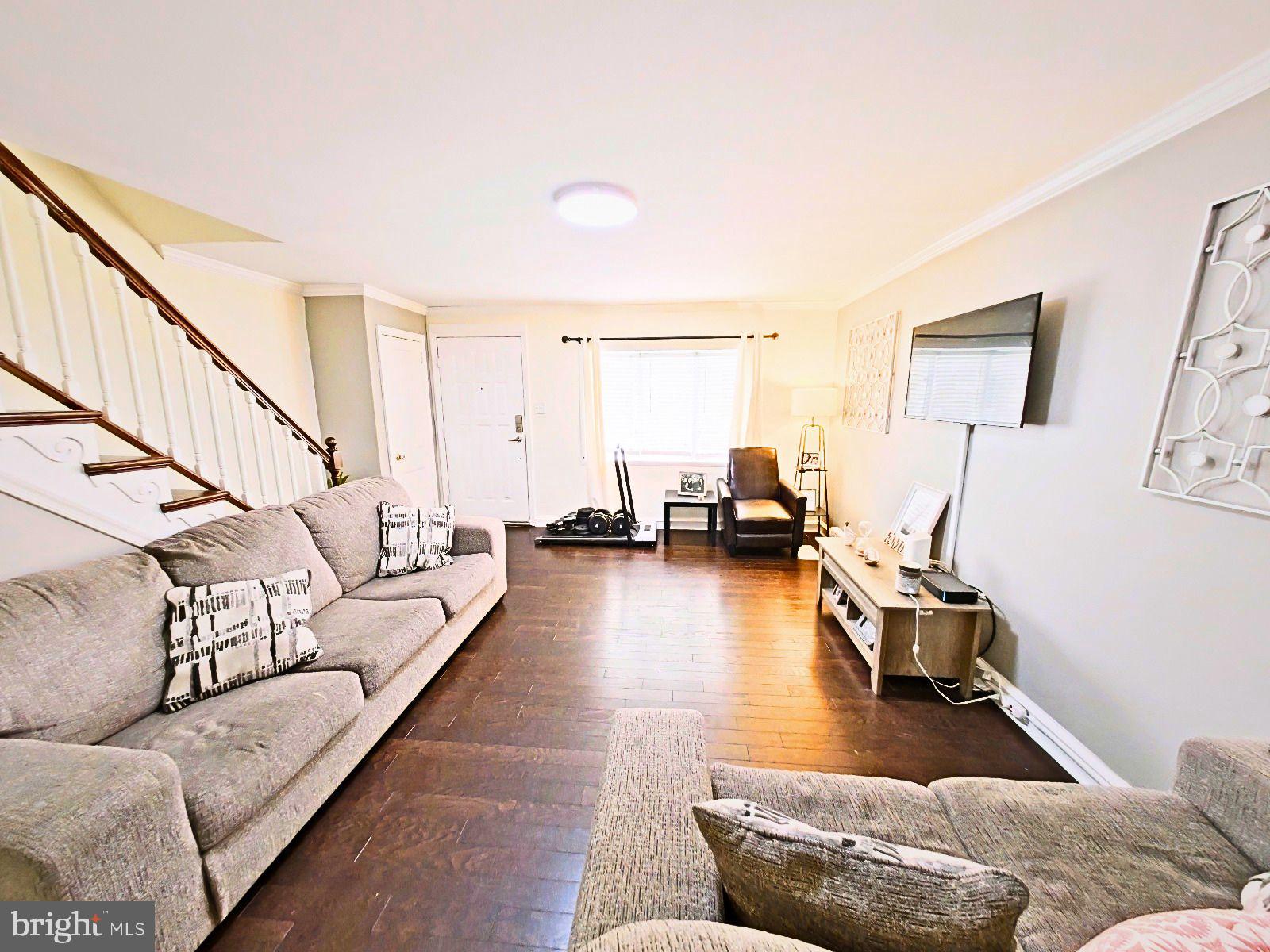 5844 Saul Street Philadelphia, PA 19149 - Photo 15 of 36 a living room with furniture and a wooden floor