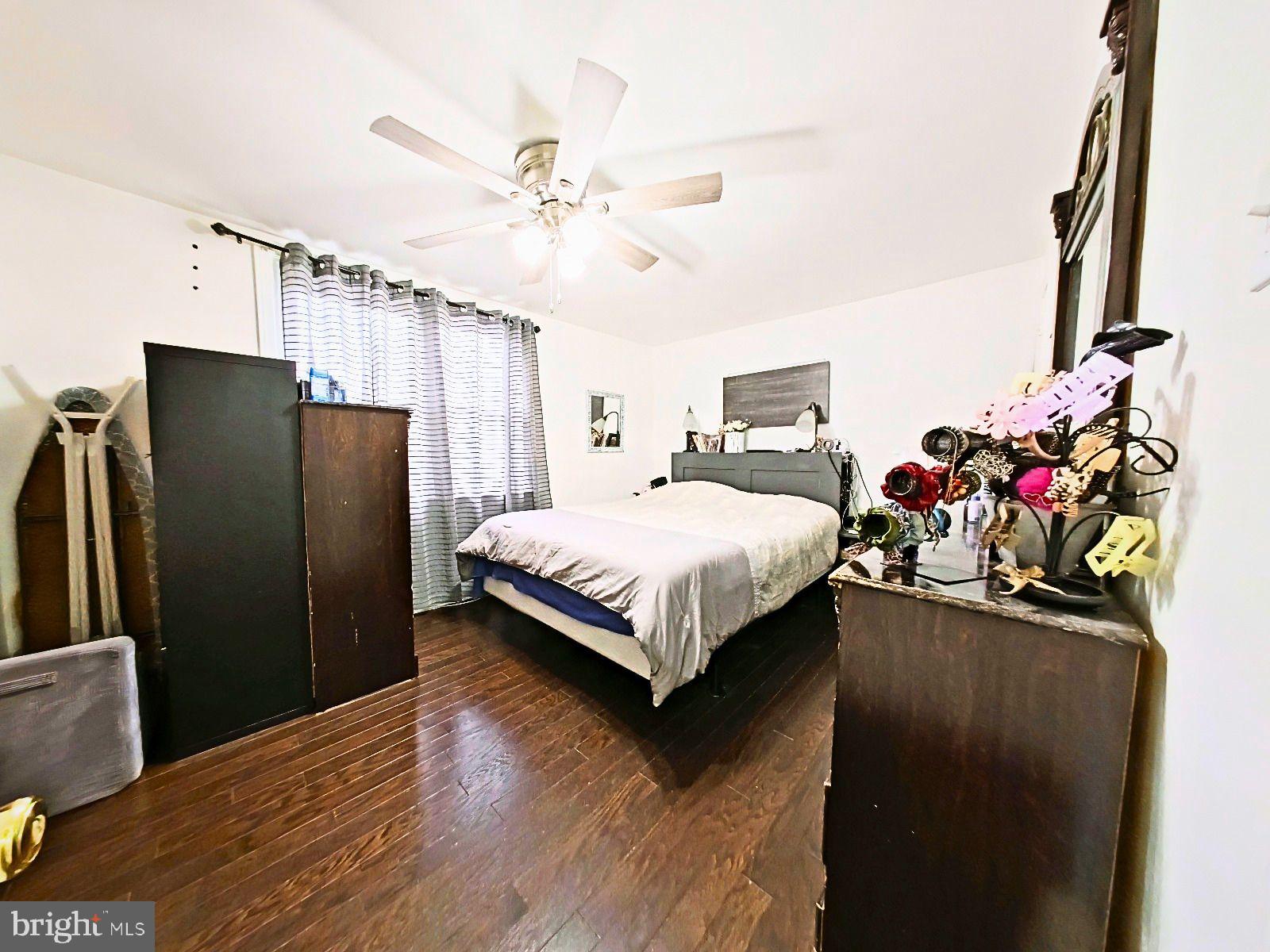 5844 Saul Street Philadelphia, PA 19149 - Photo 20 of 36 a bedroom with bed mirror and window