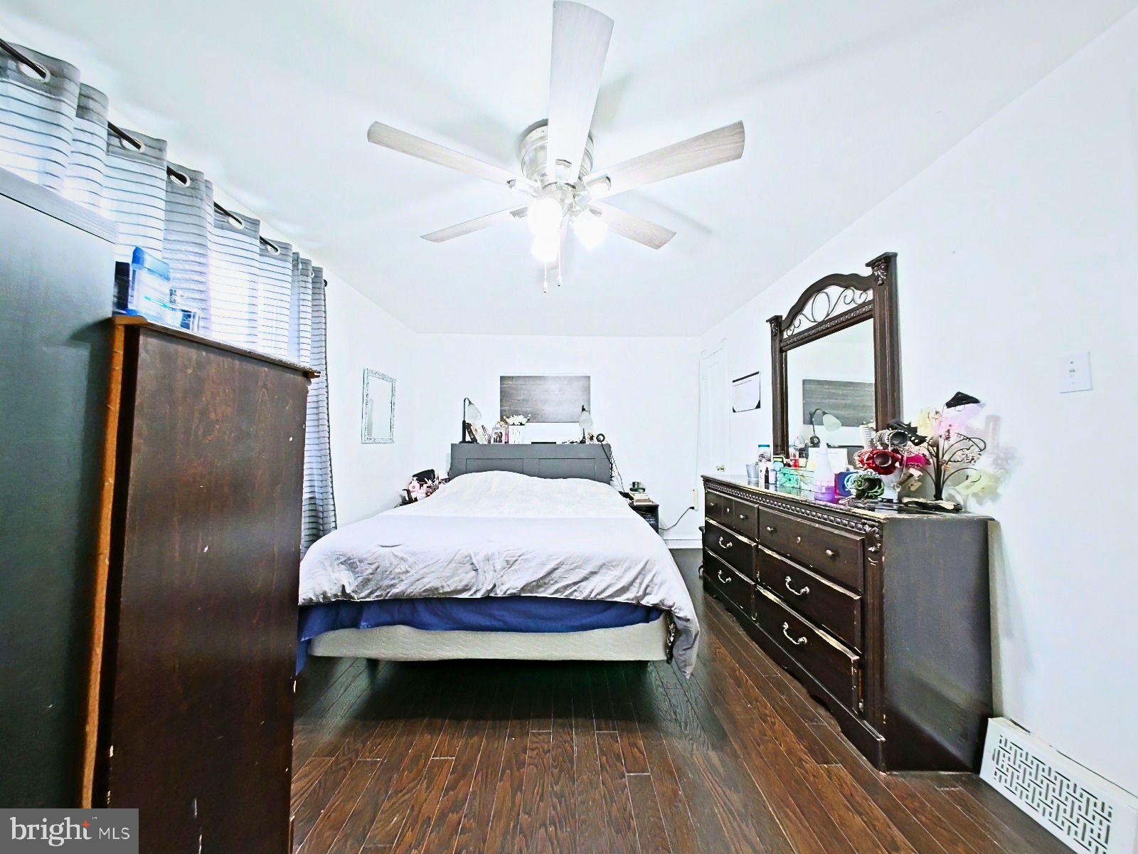5844 Saul Street Philadelphia, PA 19149 - Photo 21 of 36 a bedroom with a bed and a mirror on the dresser