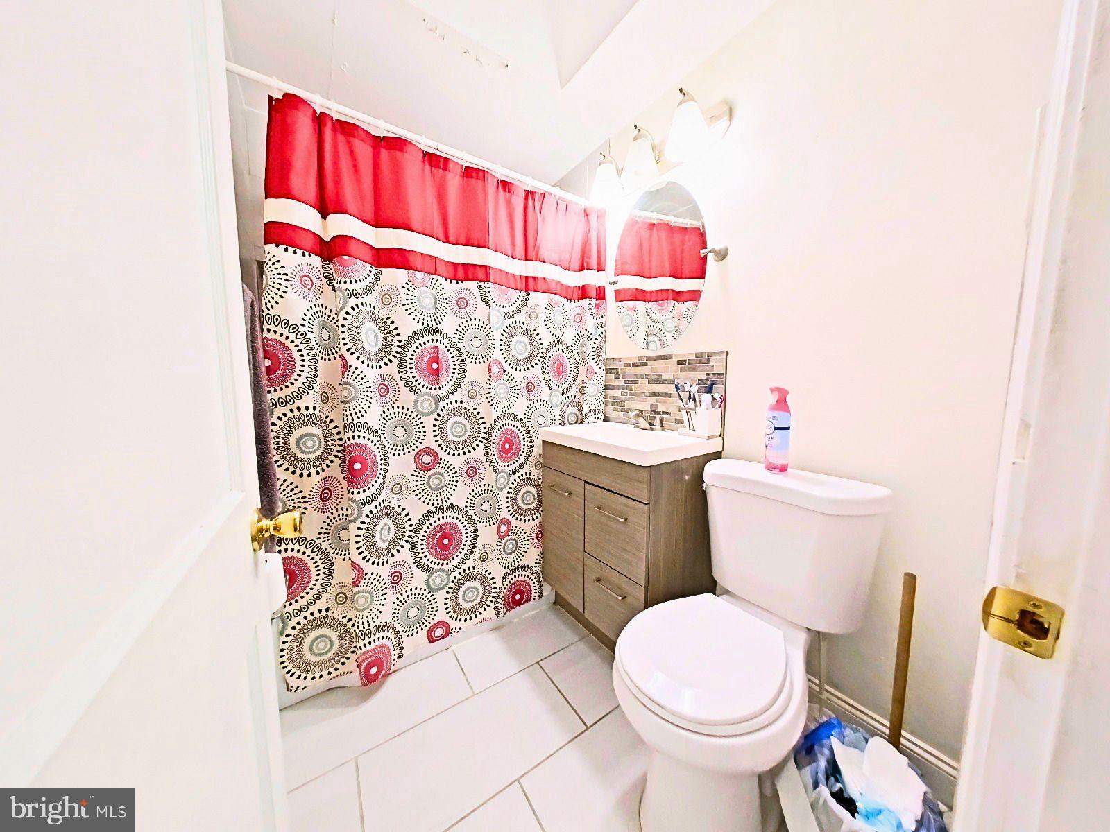 5844 Saul Street Philadelphia, PA 19149 - Photo 22 of 36 a white toilet sitting next to a bathroom sink