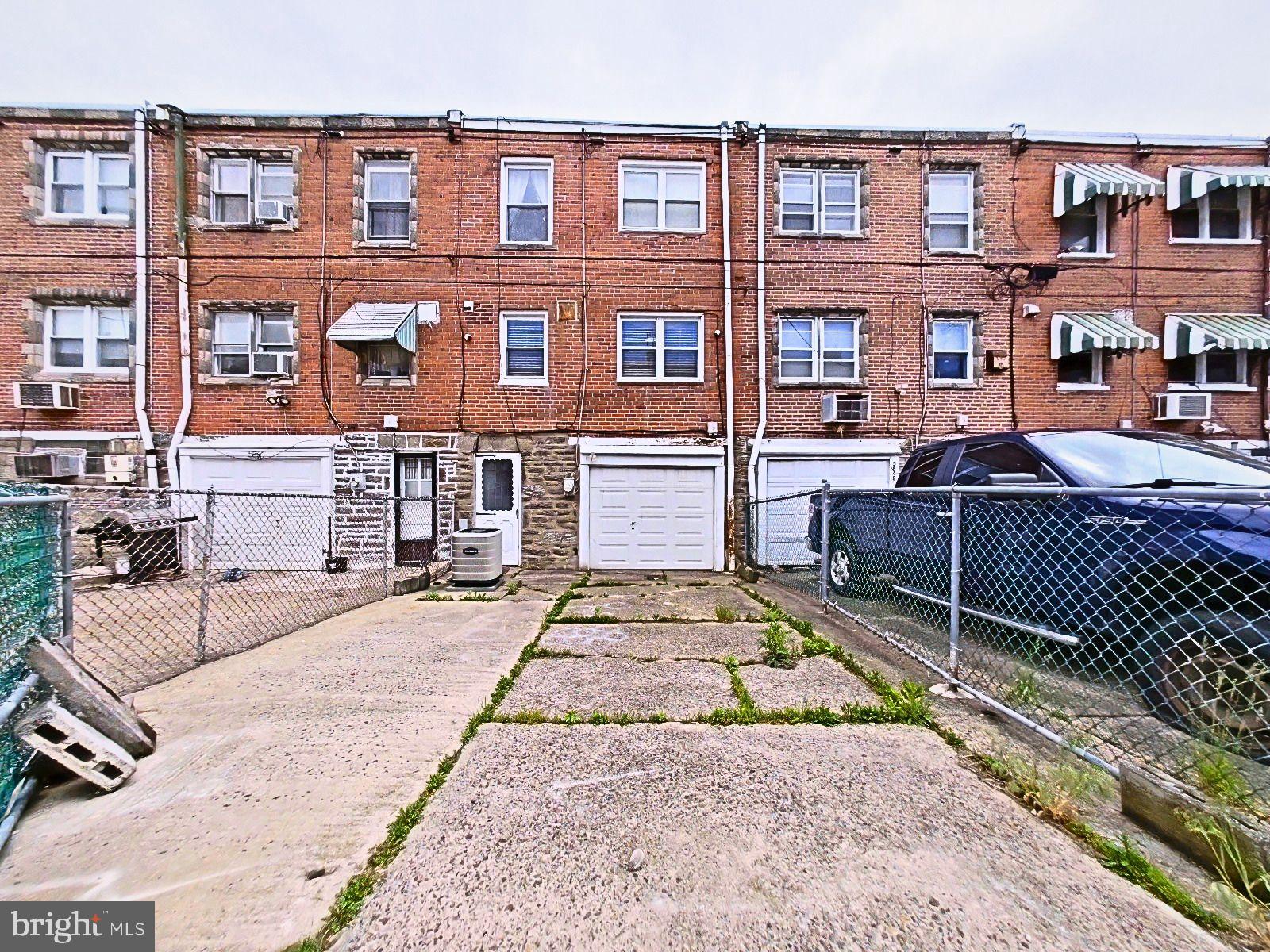 5844 Saul Street Philadelphia, PA 19149 - Photo 32 of 36 a view of a brick house with many windows