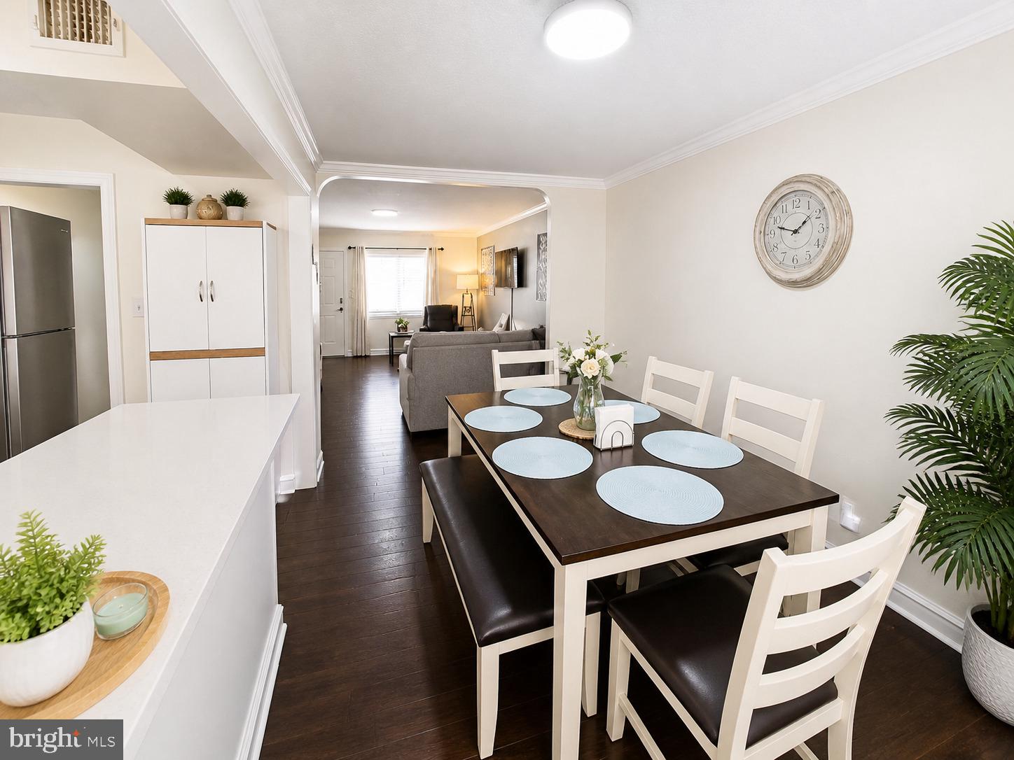 5844 Saul Street Philadelphia, PA 19149 - Photo 4 of 36 a dining room with furniture and a clock