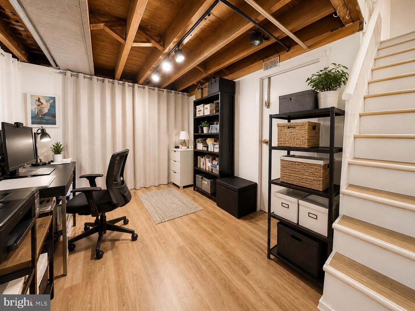 5844 Saul Street Philadelphia, PA 19149 - Photo 9 of 36 a view of a workspace with furniture and wooden floor