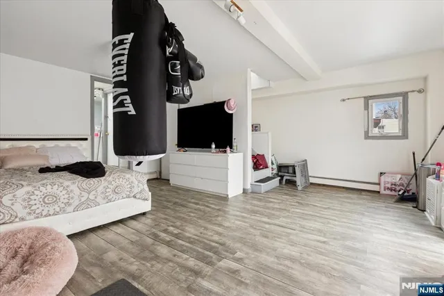 a view of a storage room with water heater and racks