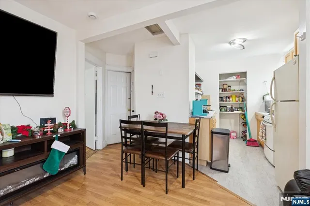 a view of a livingroom with furniture and a flat screen tv