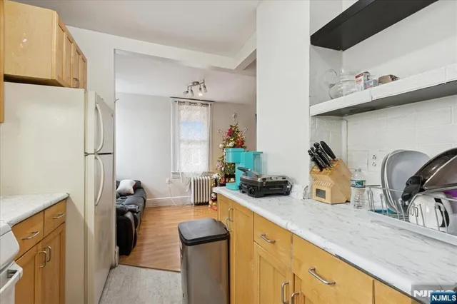 a bedroom with bed and window