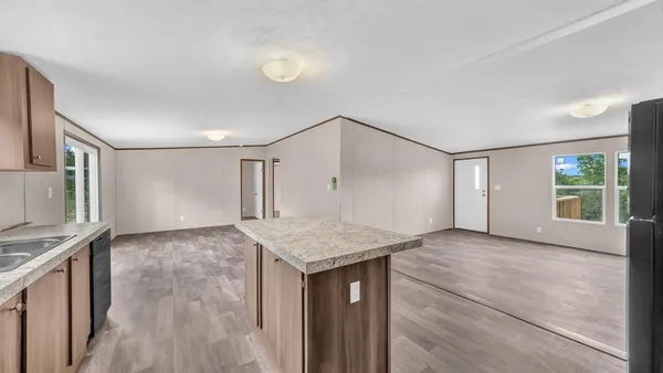 a view of a kitchen cabinets and wooden floor